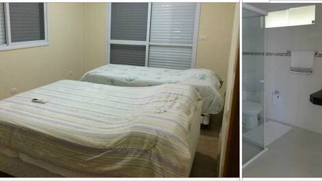 suite com uma cama de casal, uma cama de solteiro e ar condicionado