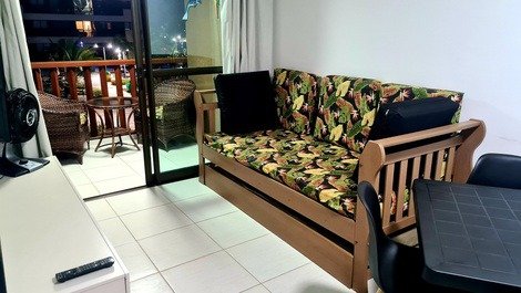 Sala com sofá bicama 