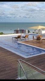 Beautiful new flat, overlooking the sea and swimming pools to relax