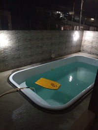 Casa com piscina ao lado da praia