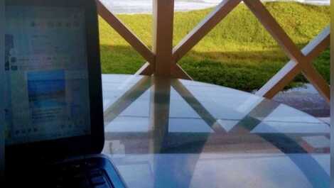 Espaço home office varanda frente mar 