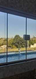 House with pool and barbecue in gated community