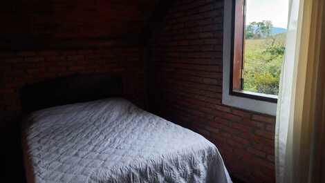 Quarto com vista para serra