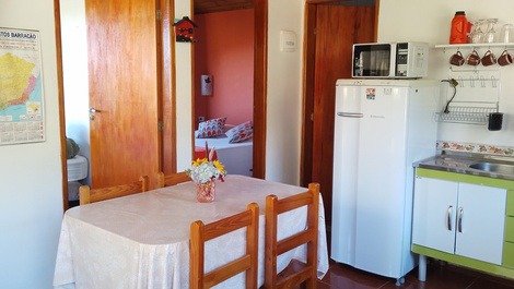Chale color carrot kitchen and small room with fireplace