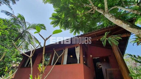 Stilt house surrounded by trees