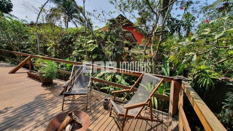 Stilt house surrounded by trees