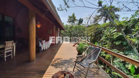 Stilt house surrounded by trees