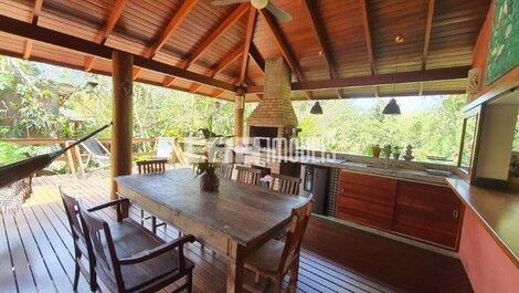 Stilt house surrounded by trees