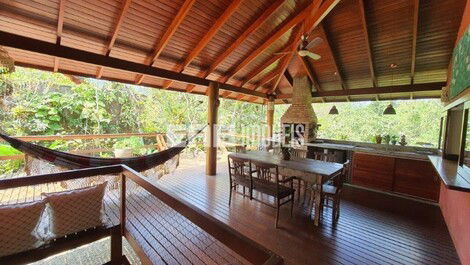 Stilt house surrounded by trees