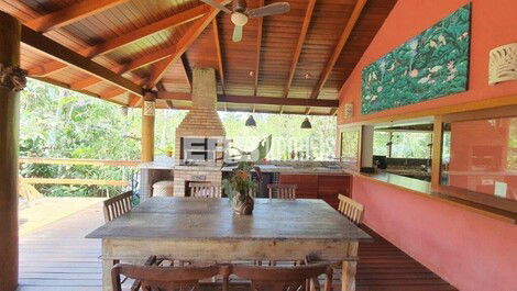 Stilt house surrounded by trees