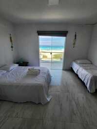 Feet in the sand, seaside refuge in Cabo Frio