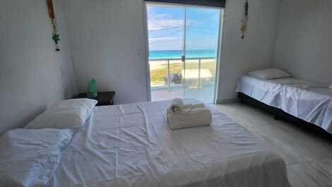 Feet in the sand, seaside refuge in Cabo Frio