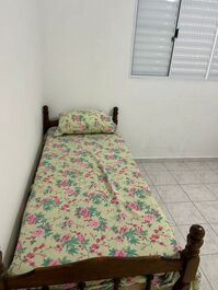 Cama no quarto suíte