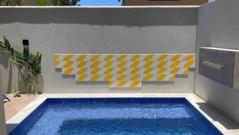 Casa em condomínio na praia de camburi