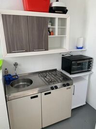 1 Dormitorio Vista Lateral com Pé na Areia