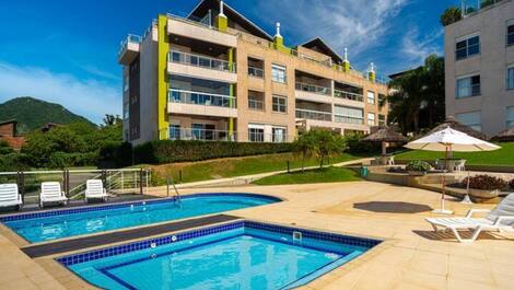 Apartment straight out of a soap opera, resort-style, right on the sand, swimming pools.