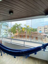 Apartment in a building with a swimming pool.