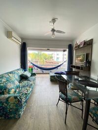 Apartment in a building with a swimming pool.