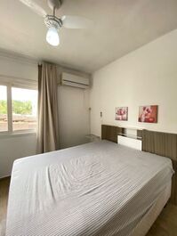 Apartment in a building with a swimming pool.