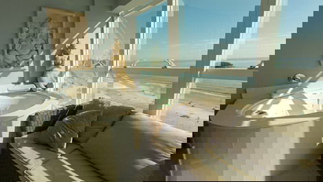 Oceanfront property with jacuzzi and charcoal grill, including 2 private parking spaces.