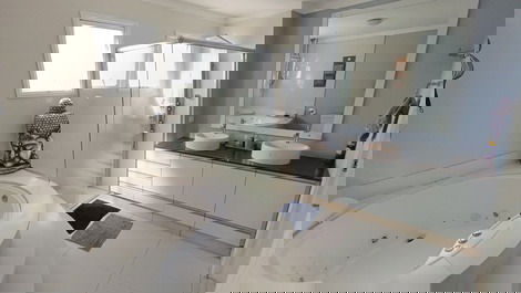 Oceanfront property with jacuzzi and charcoal grill, including 2 private parking spaces.