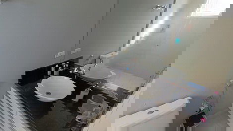 Oceanfront property with jacuzzi and charcoal grill, including 2 private parking spaces.